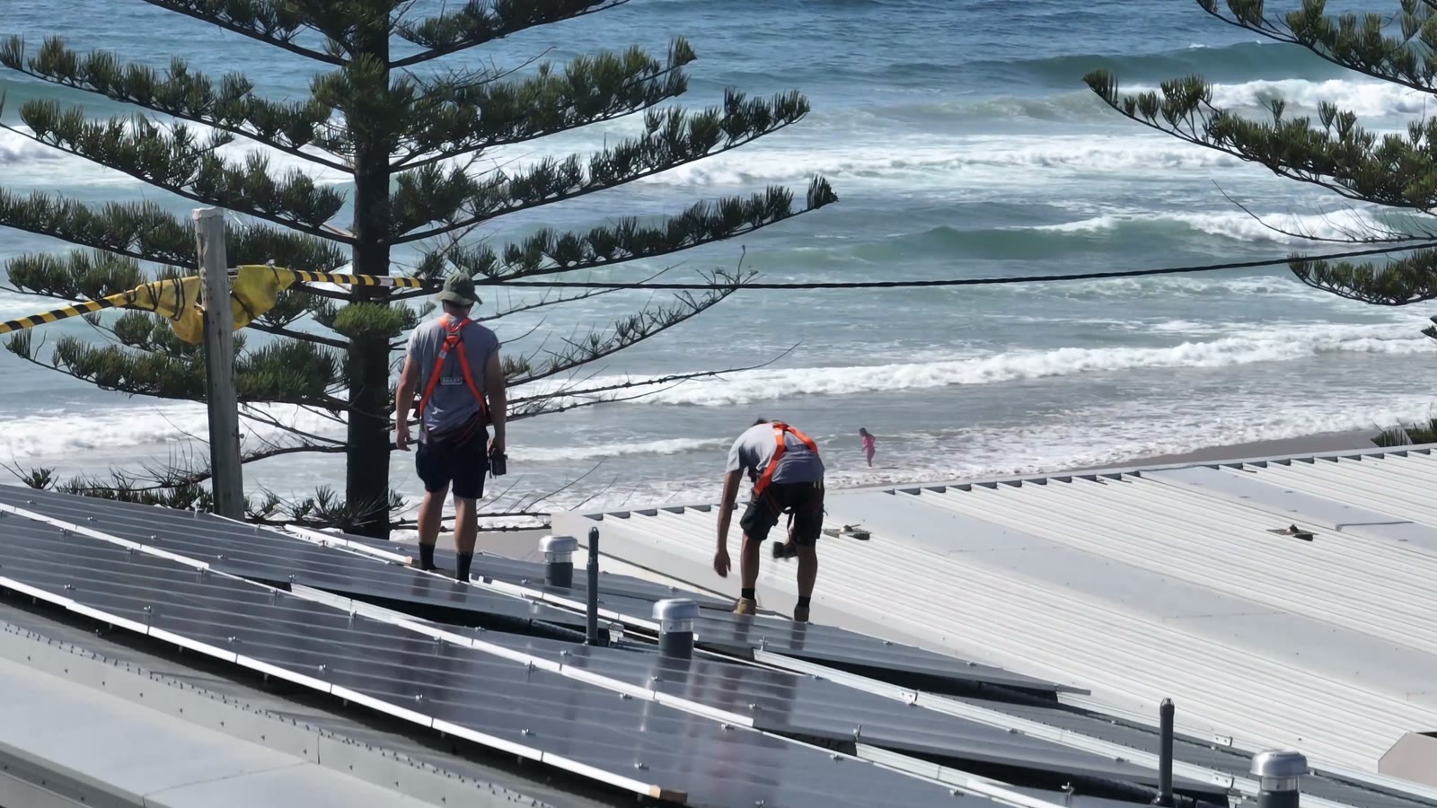 The ProSolar crew installing solar panels on a beachside roof, video preview